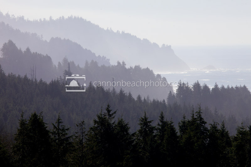 Mountain ridges stretch down to the ocean along the Oregon Coast.