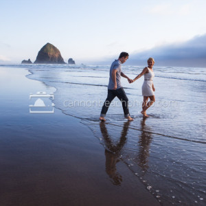 Couple Walking into the Pacific Hand in Hand