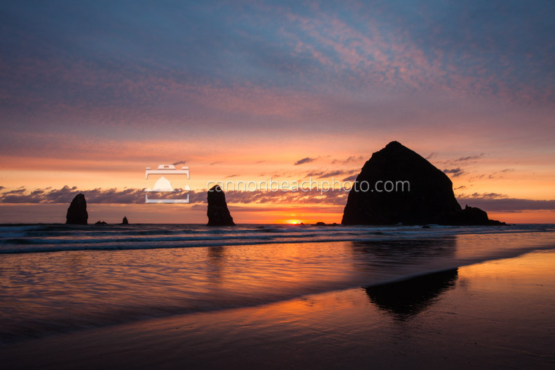 A beautiful muted sunset at Haystack Rock in Cannon Beach, Oregon.