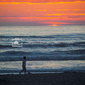Child Walking at Sunset