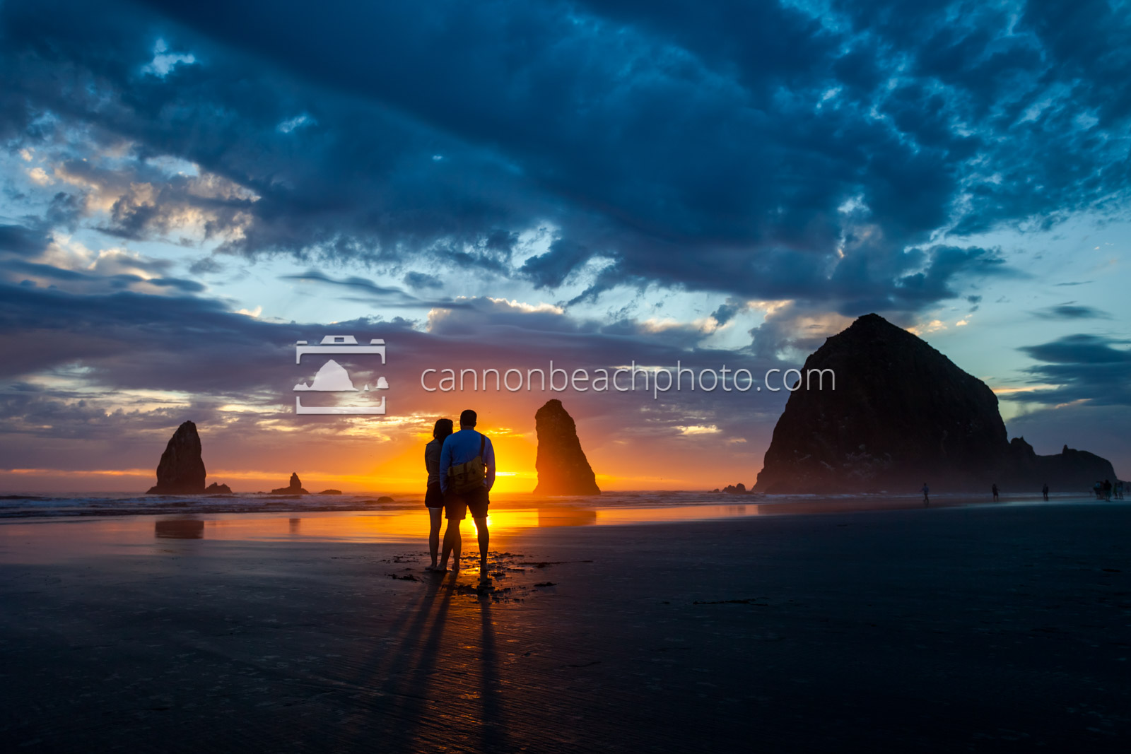 Couple Silhouetted at Haystack by the Sunset