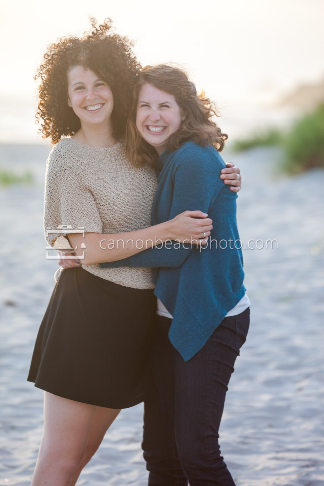 Two Sisters Grinning on the Beach