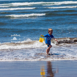 Boy Playing at the Ocean