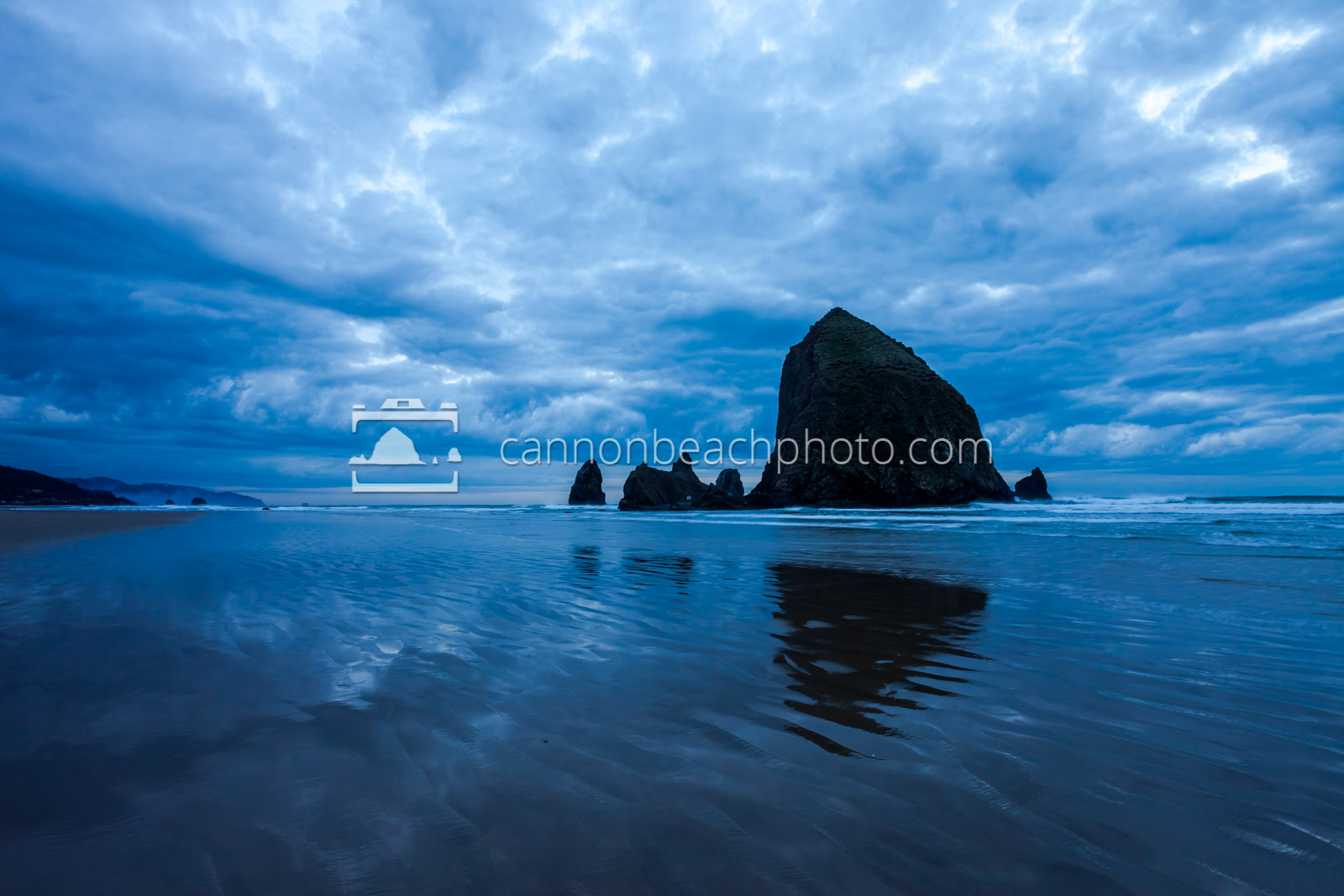 Wide View of Dynamic Blue Clouds Over Haystack Rock 1