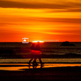 Couple Walking as the Sun Drops