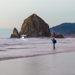 Photographer with Haystack Rock near Sunset