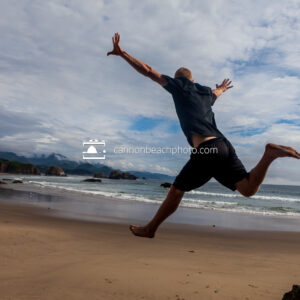 Man Jumping at Crescent Beach, Ecola State Park 1
